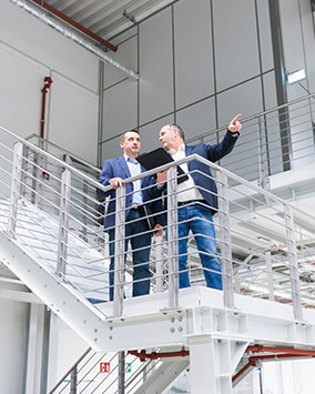 building specifiers standing on a staircase